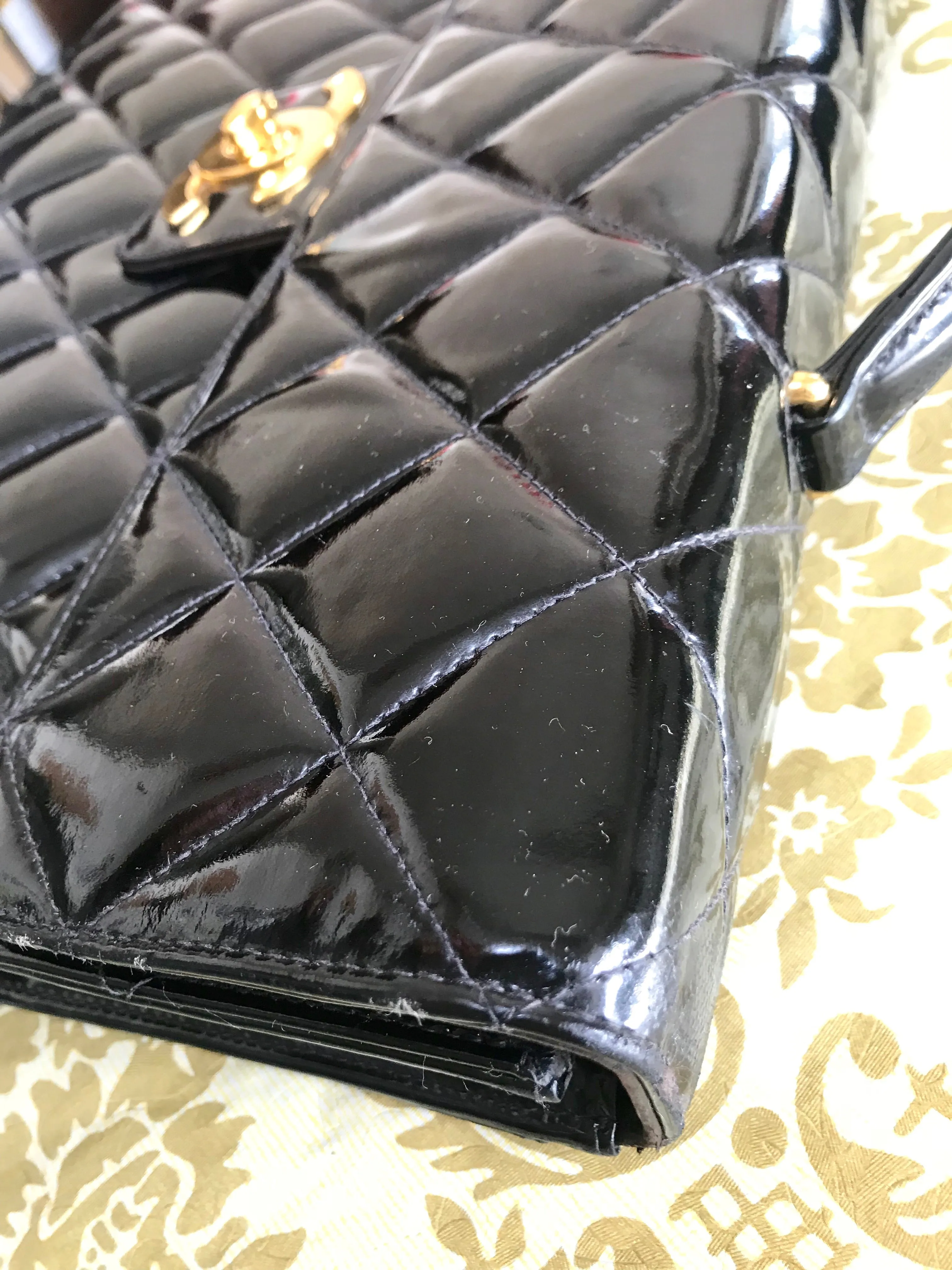 1990s. Vintage CHANEL black patent enamel briefcase business bag with golden large CC motif. Classic and traditional masterpiece you must have.