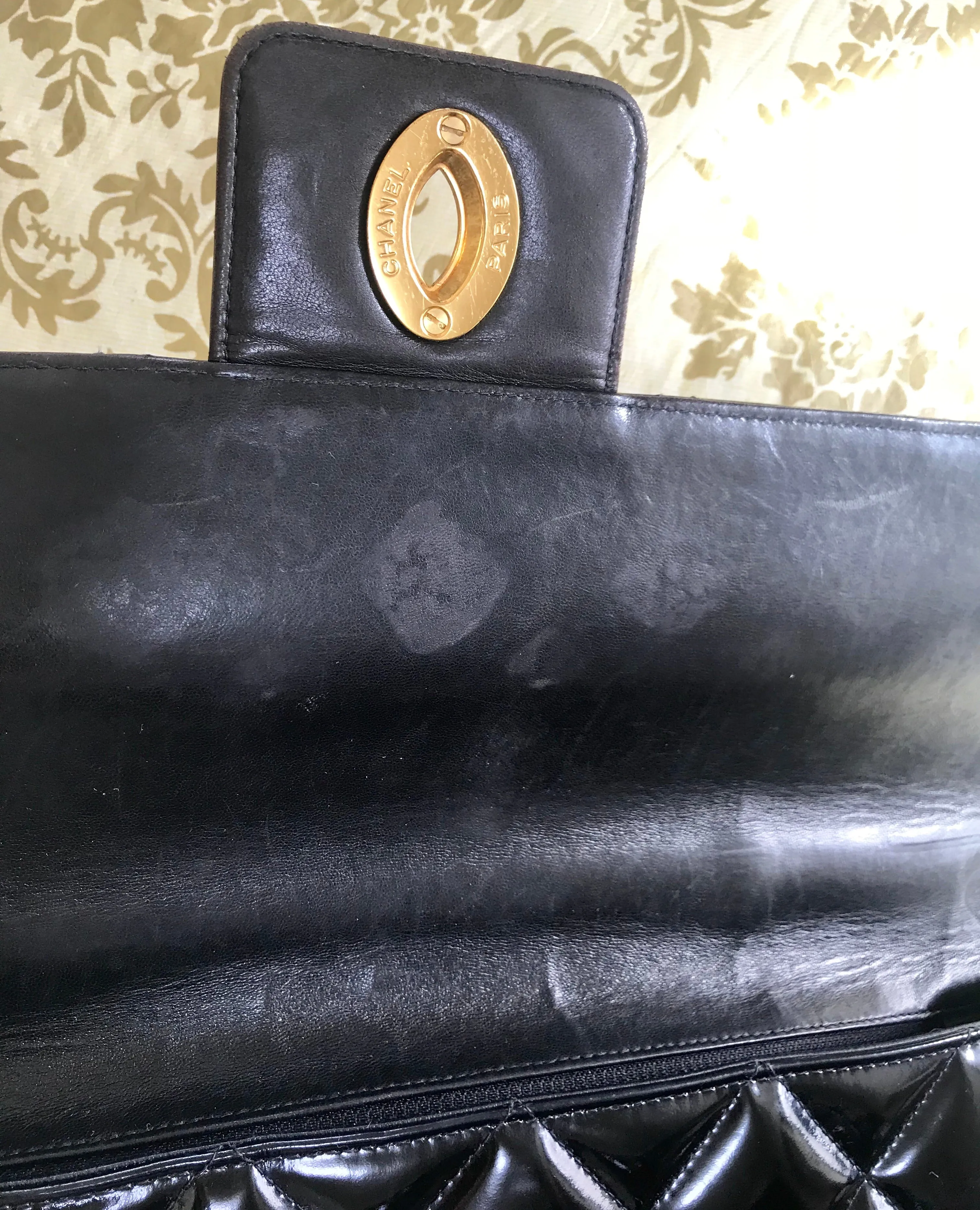 1990s. Vintage CHANEL black patent enamel briefcase business bag with golden large CC motif. Classic and traditional masterpiece you must have.