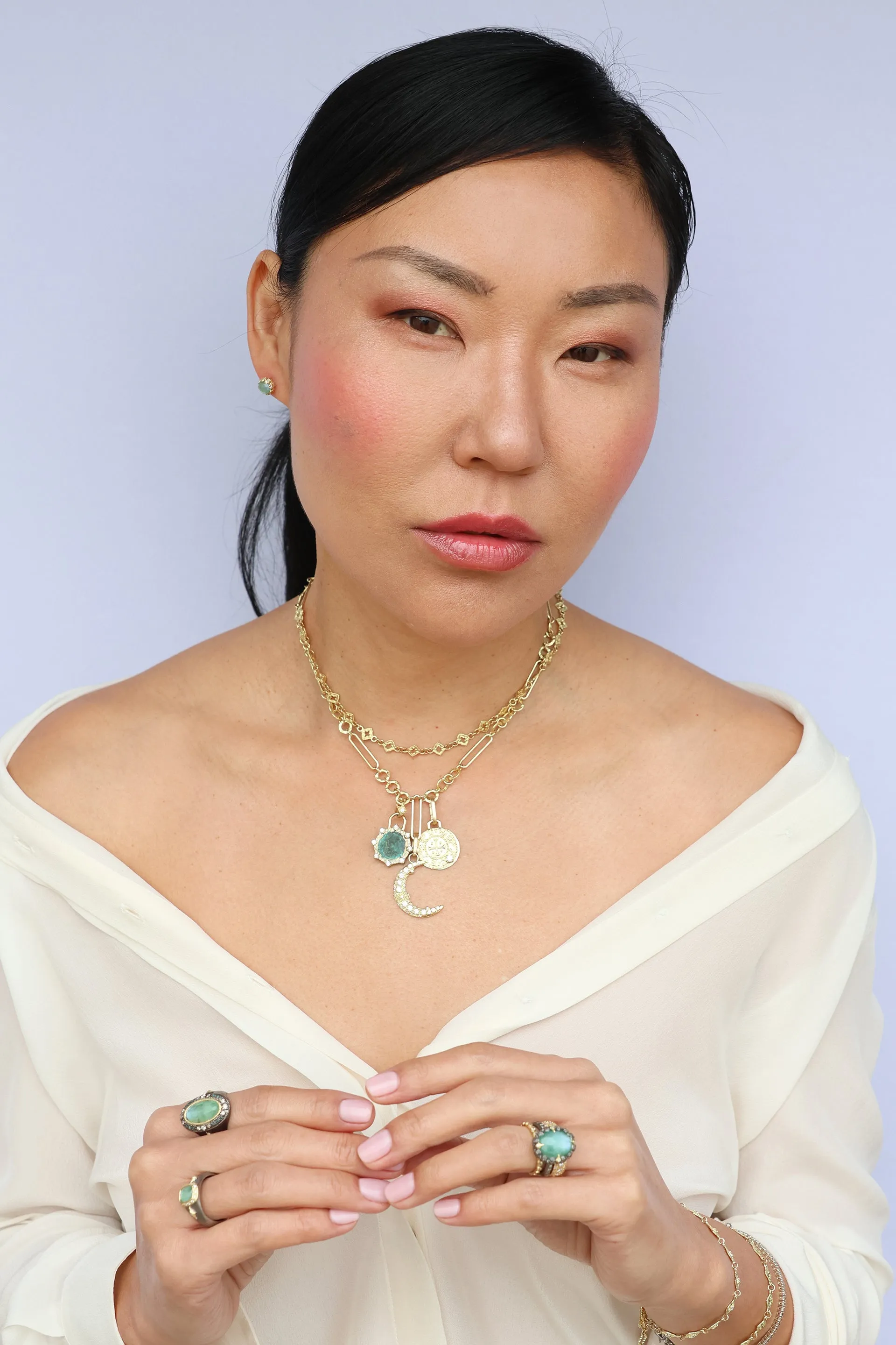 OVAL EMERALD AND CRIVELLI STATEMENT RING