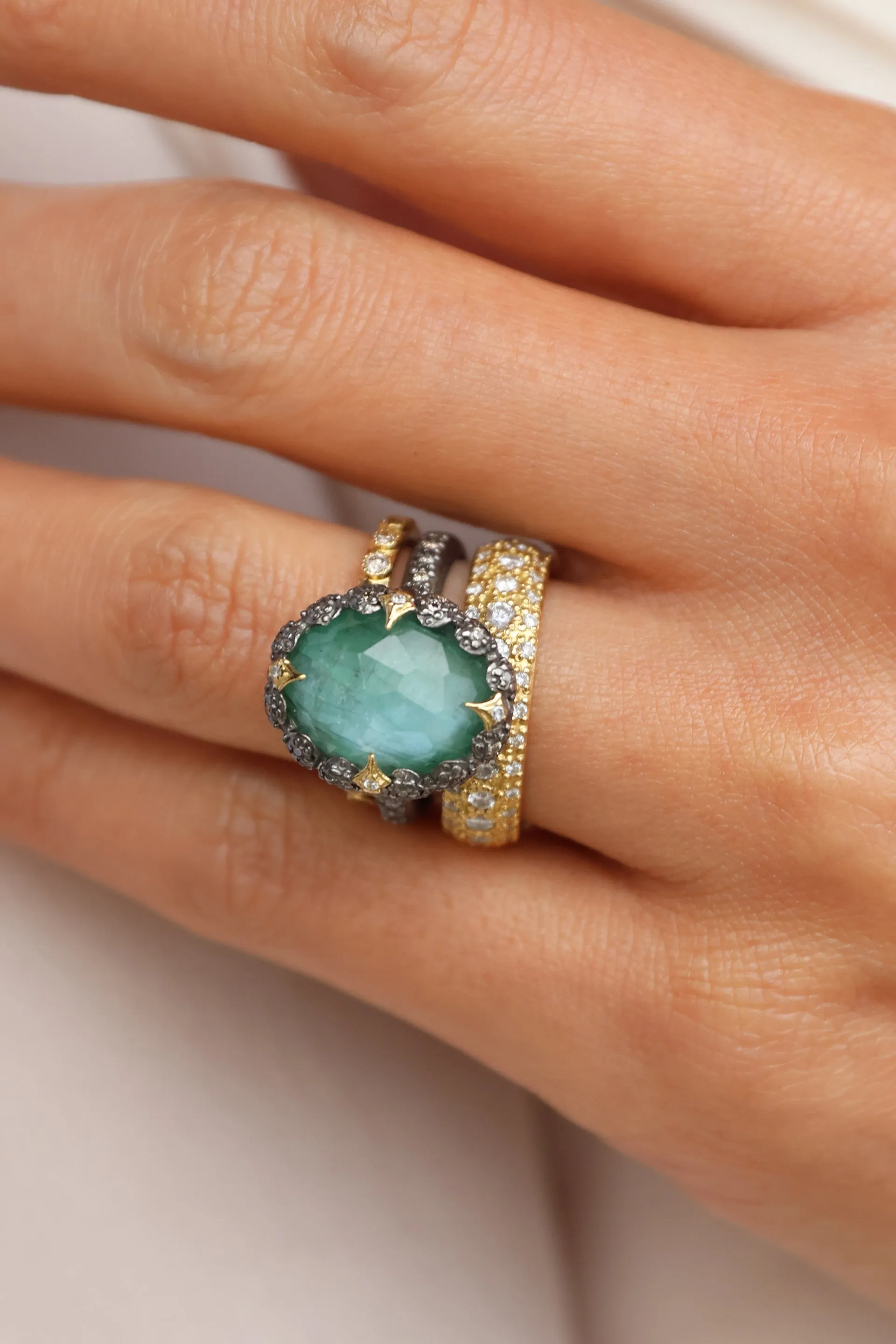 OVAL EMERALD AND CRIVELLI STATEMENT RING